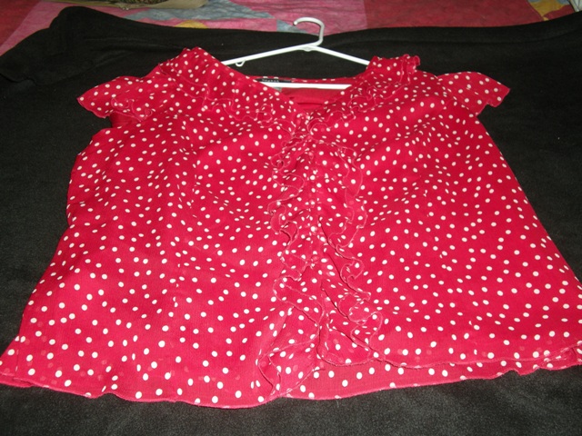 Red pola dot blouse with ruffle down front