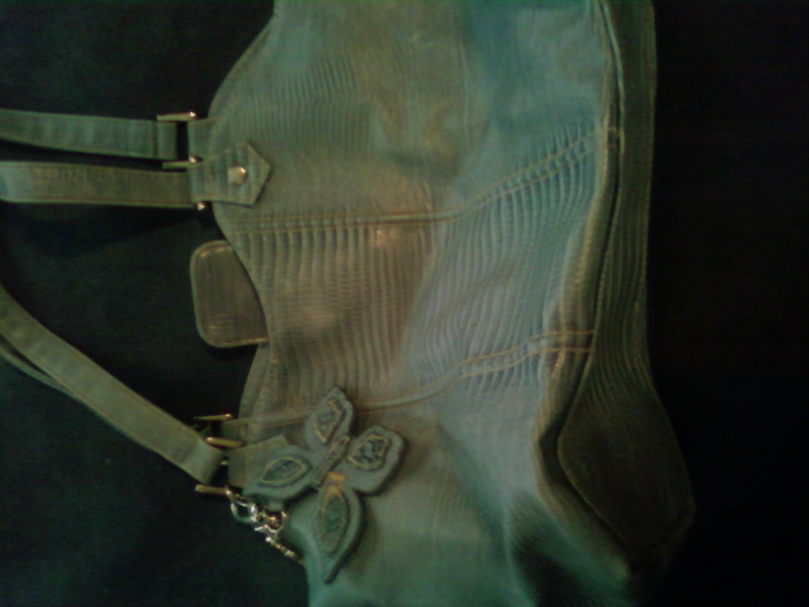 Ligtht blue handbag with butteyfly dangle