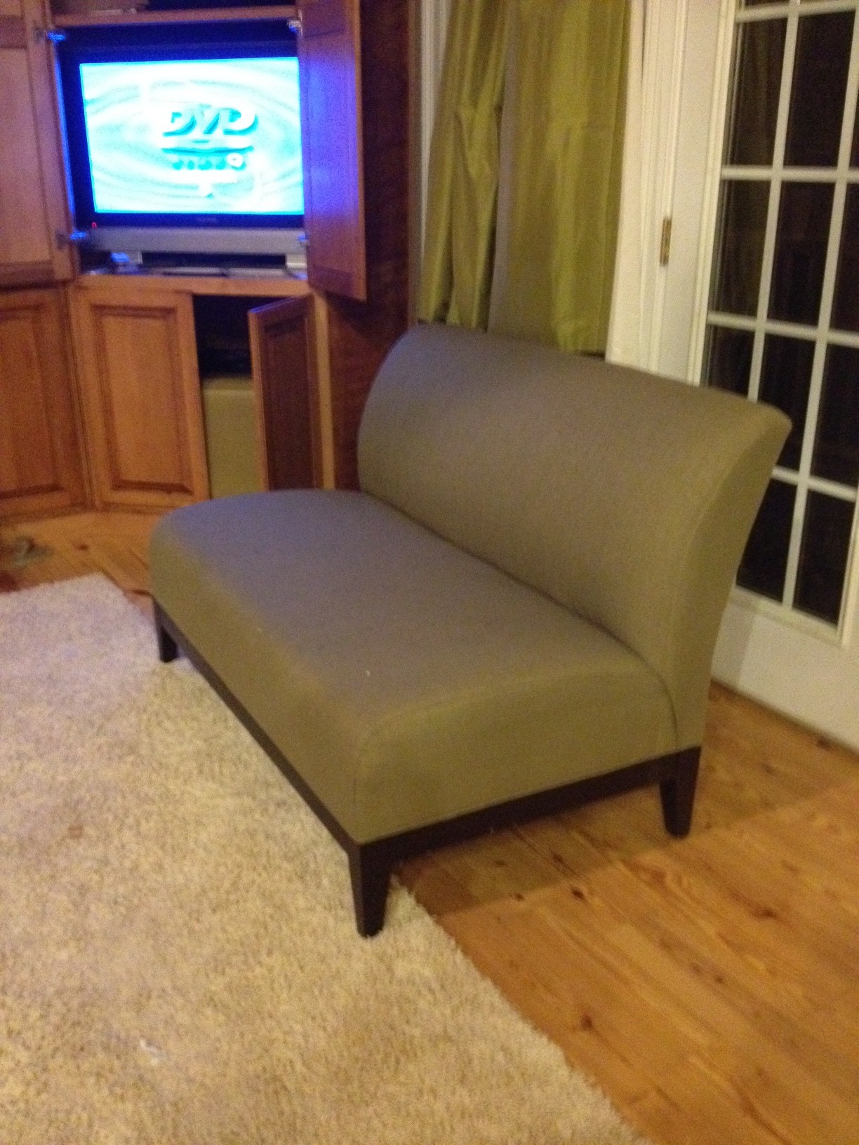 Olive green armless love seat