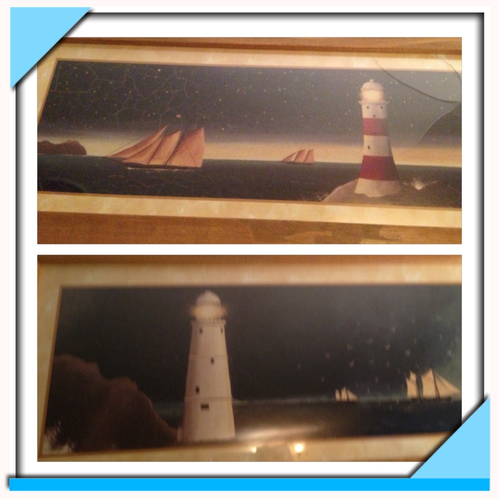 2 framed lighthouse pictures