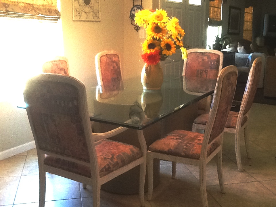 Beautiful large beveled glass dinning table with 4 side chairs and 2 captain chairs