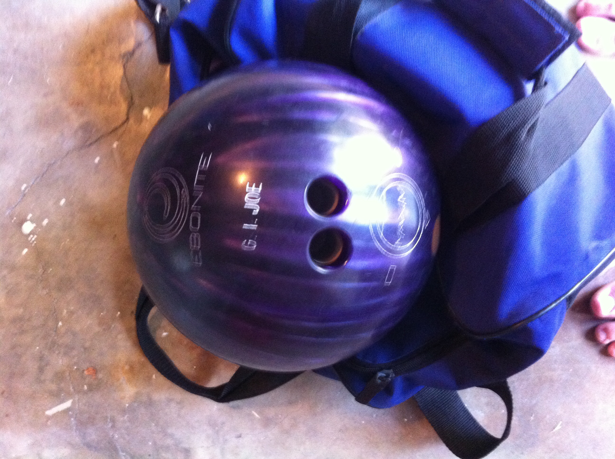 Purple bowling ball with bag
