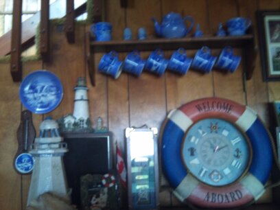 Blue & white \"farmer\'\'s home\" mugs, plate, trivets, bells, s&p