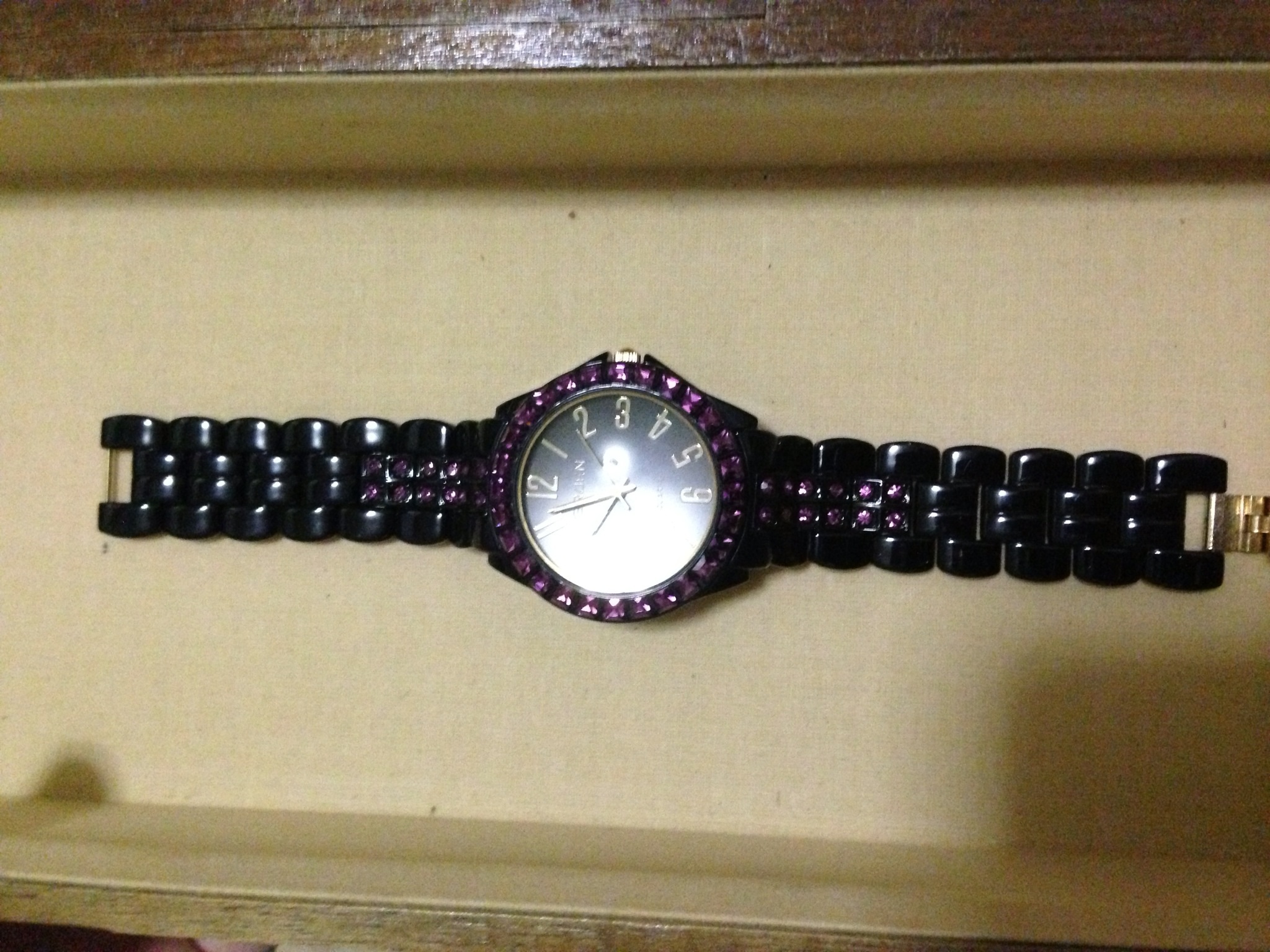 Black watch with purple stones