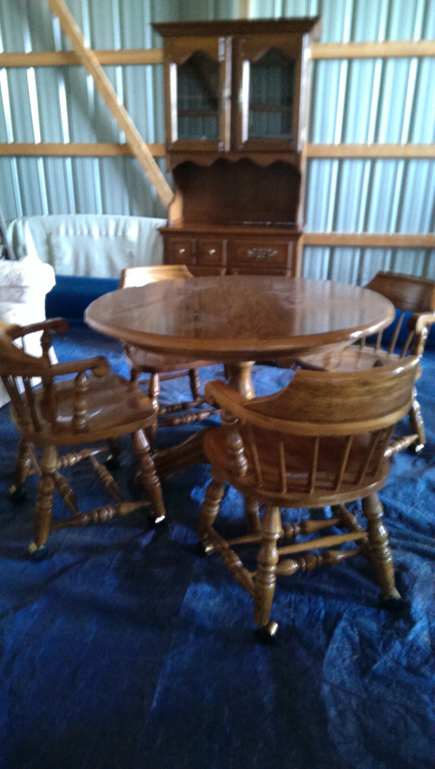 Table, 4 captain chairs, china cabinet