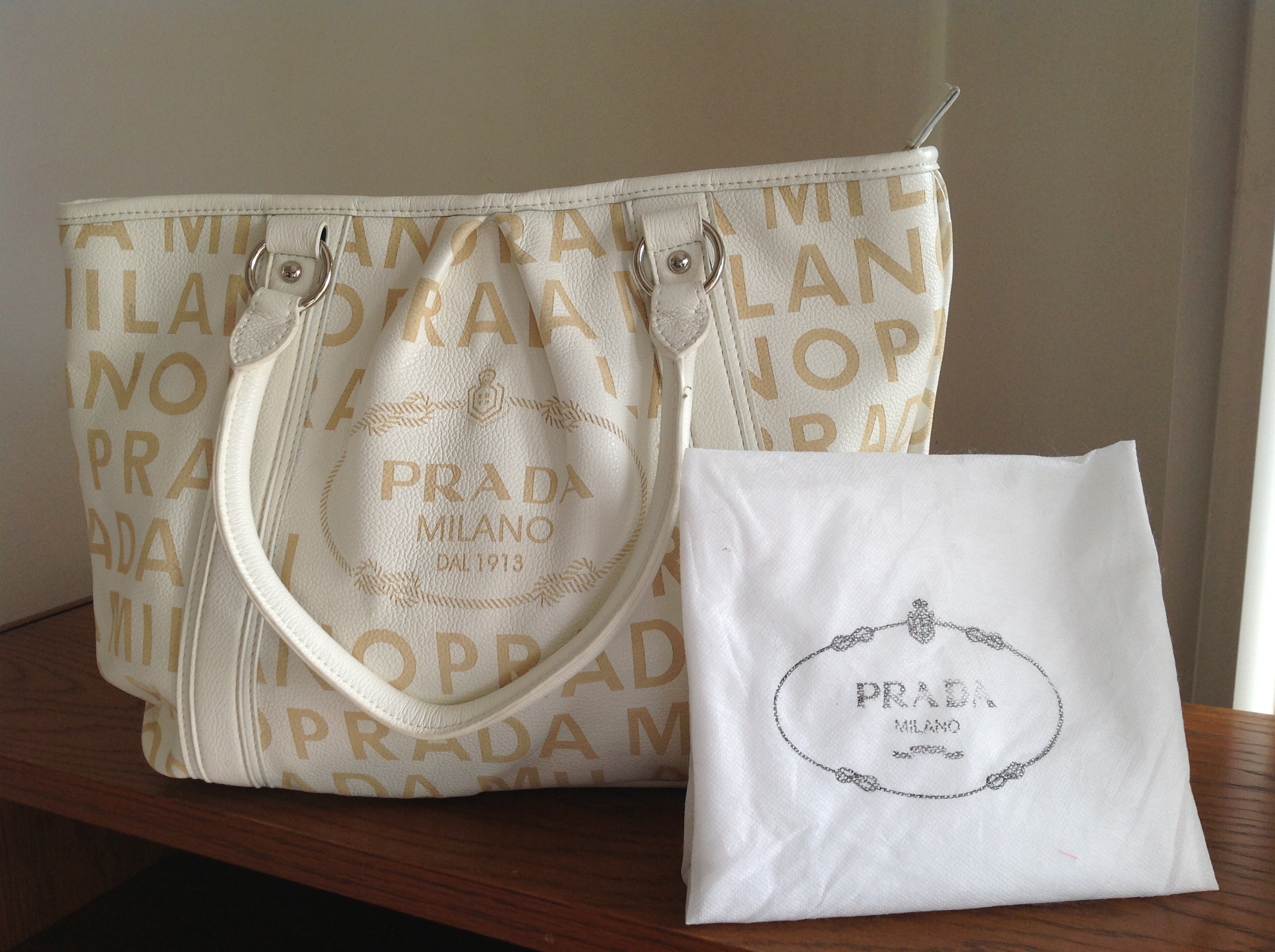 Vanilla colored Prada purse asking price $40.00
