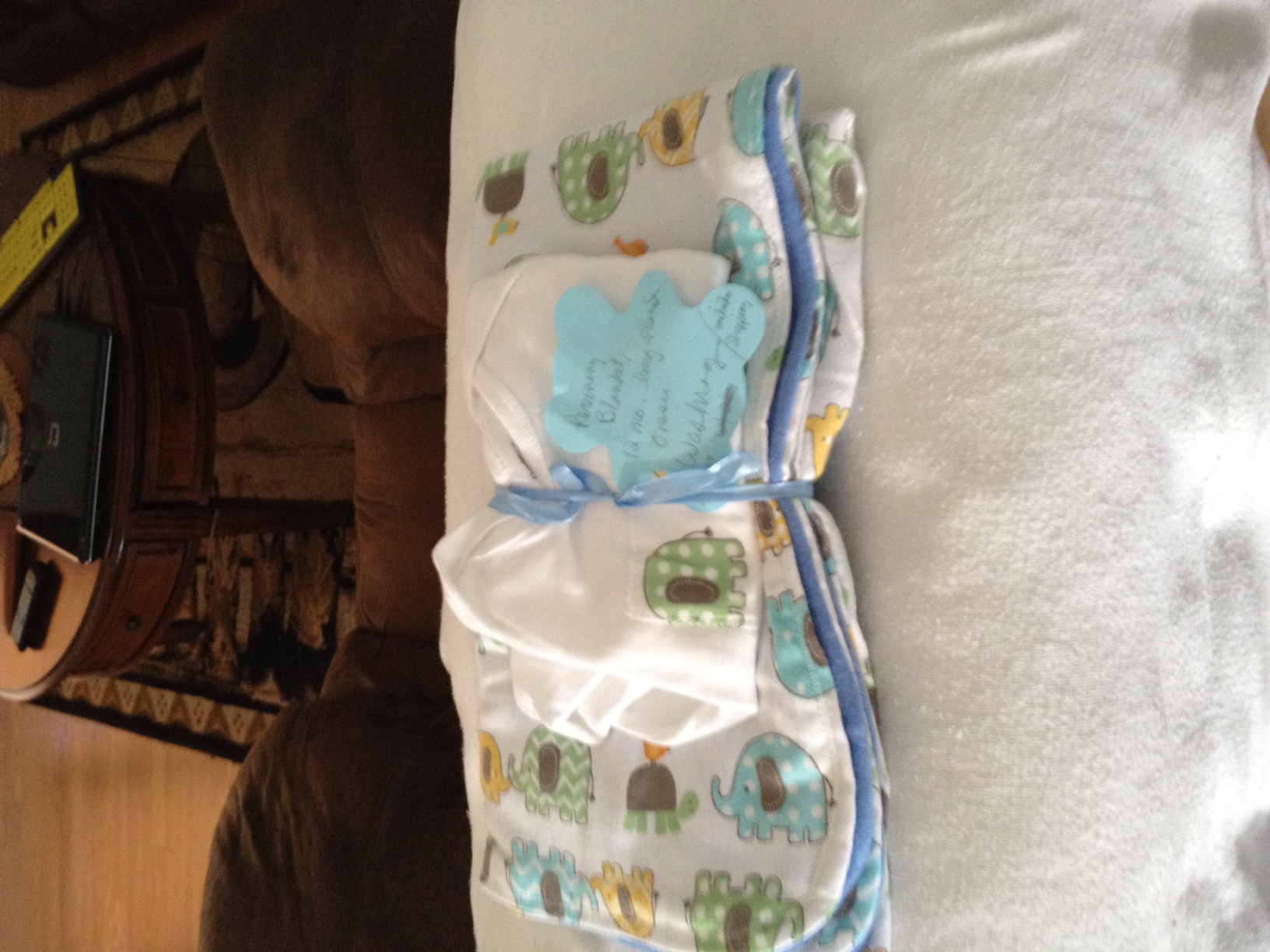 Receiving blanket, 12-month long-sleeved onesie and wash cloth