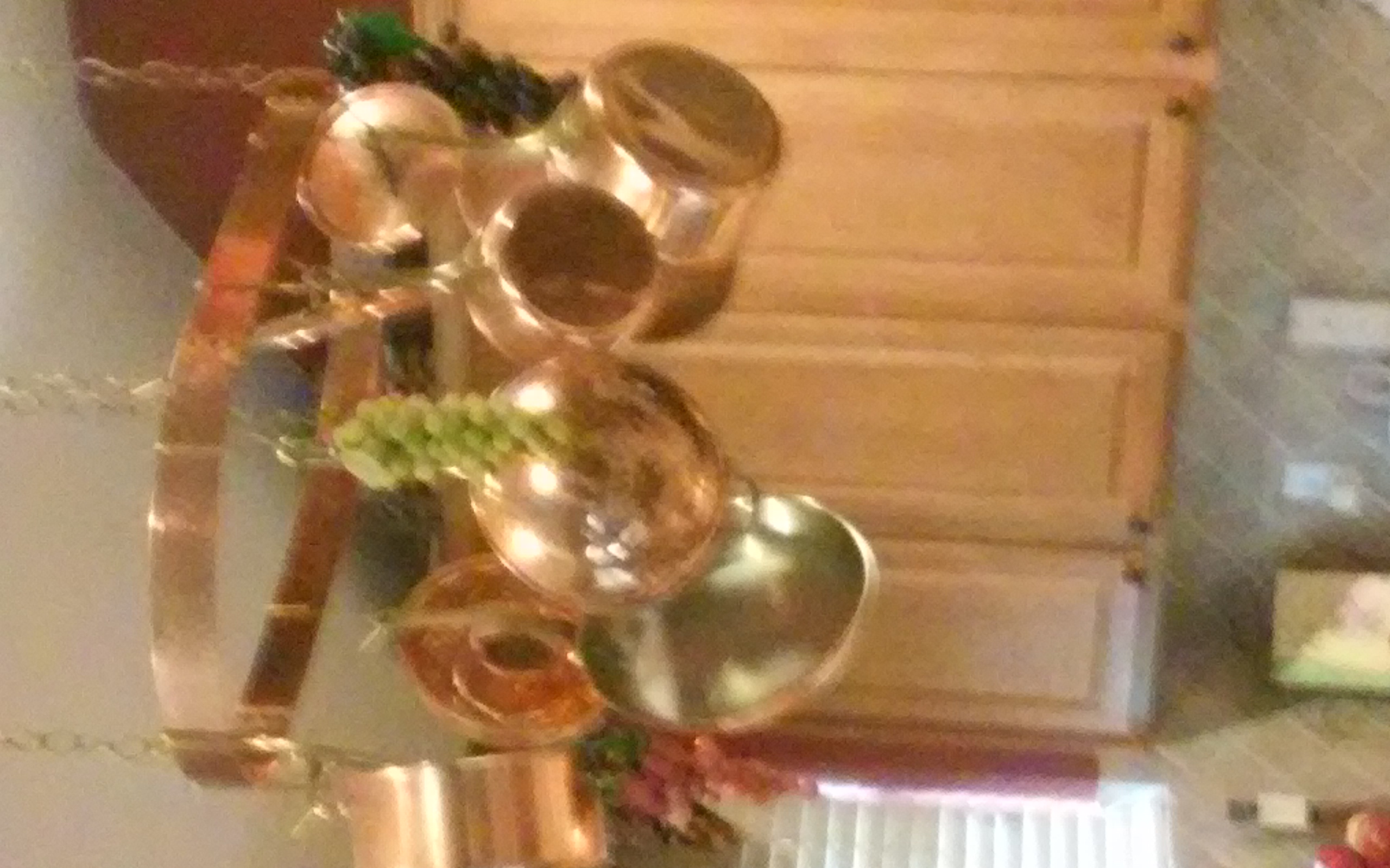 copper pot rack with matching pots/lids