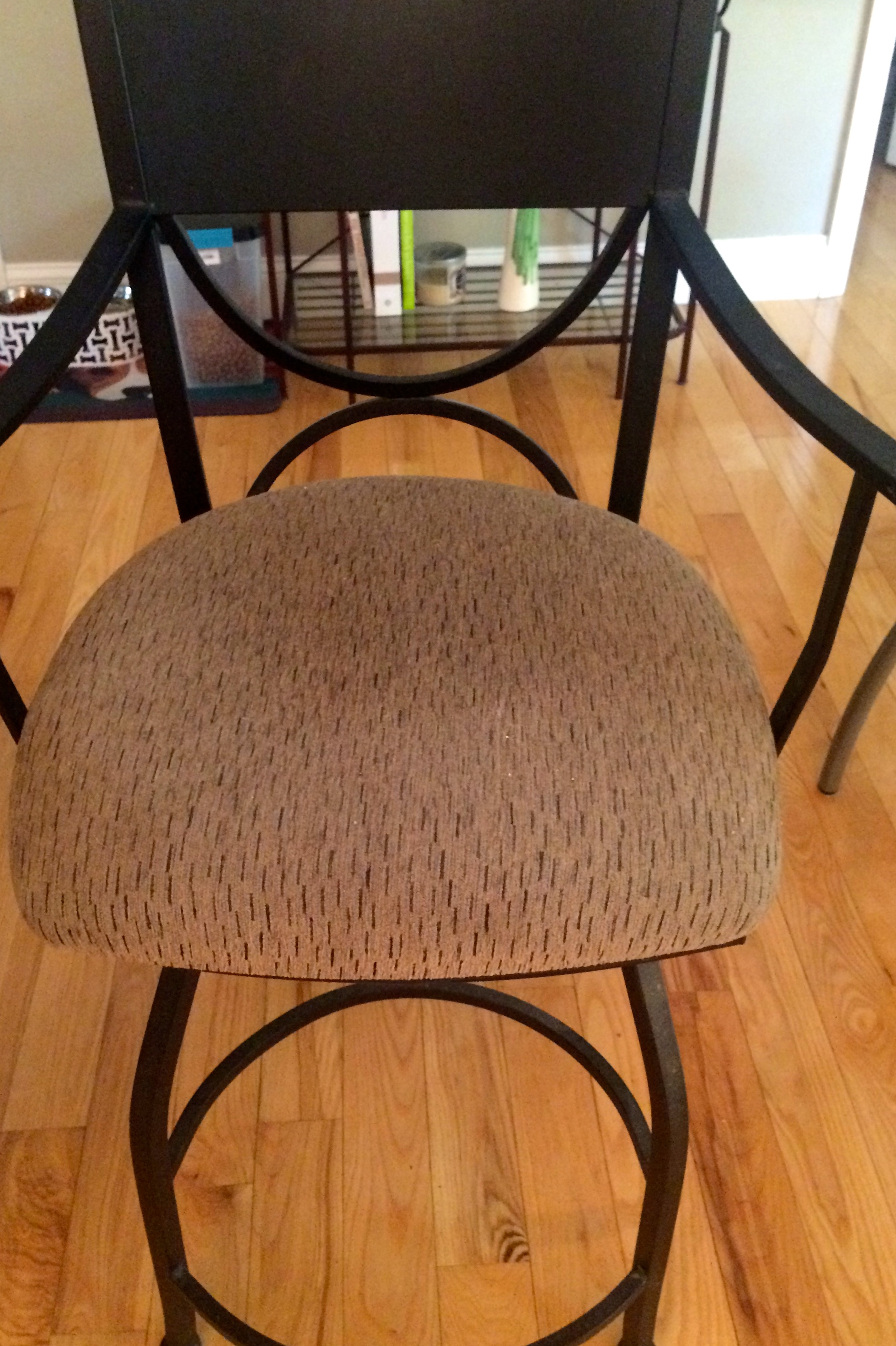 Black iron bar stool with cushion