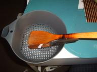 cooking strainer, knife and wooden spatula
